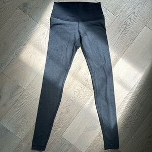 Lululemon high rise black and grey striped leggings.